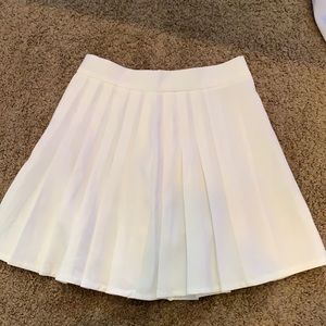 white pleaded skirt